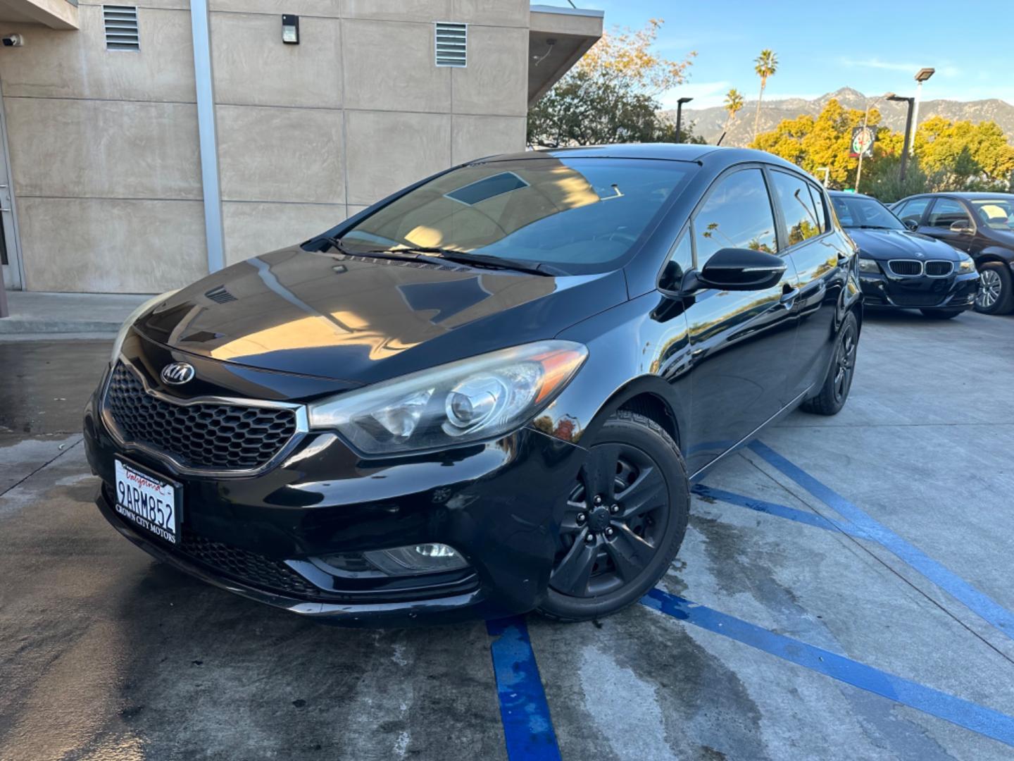 2016 Black /Black Kia Forte 5-Door Cloth (KNAFK5A87G5) with an 4 CYLINDER engine, Automatic transmission, located at 30 S. Berkeley Avenue, Pasadena, CA, 91107, (626) 248-7567, 34.145447, -118.109398 - Embark on a Journey of Style and Efficiency with the 2016 Kia Forte Hatch - Now Available at Our Premier Pasadena, CA Dealership Welcome to our BHPH dealership in Pasadena, CA, where we proudly present the 2016 Kia Forte Hatch, a vehicle that seamlessly blends stylish design, modern technology, a - Photo#0